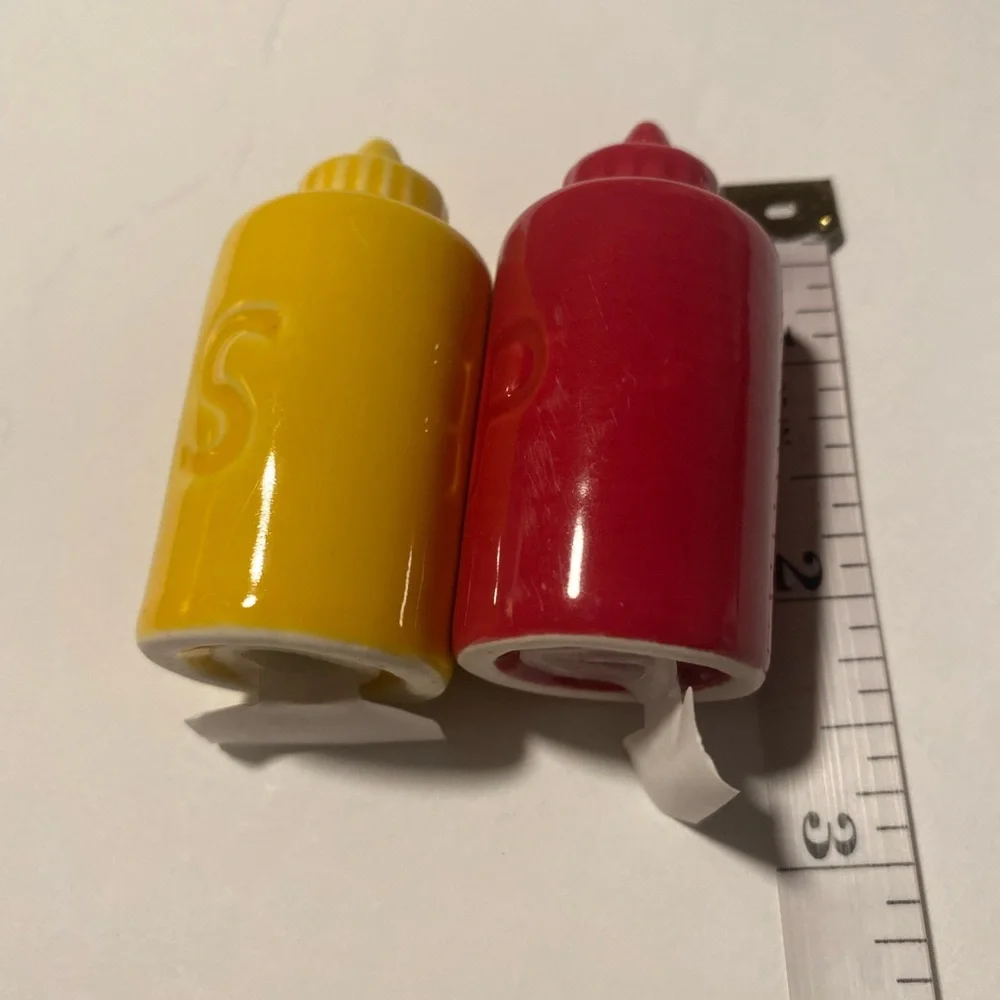 Red and Yellow Condiment Shakers